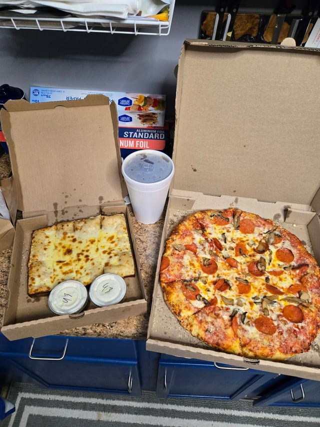 One large two topping, super styx and 2 liter.